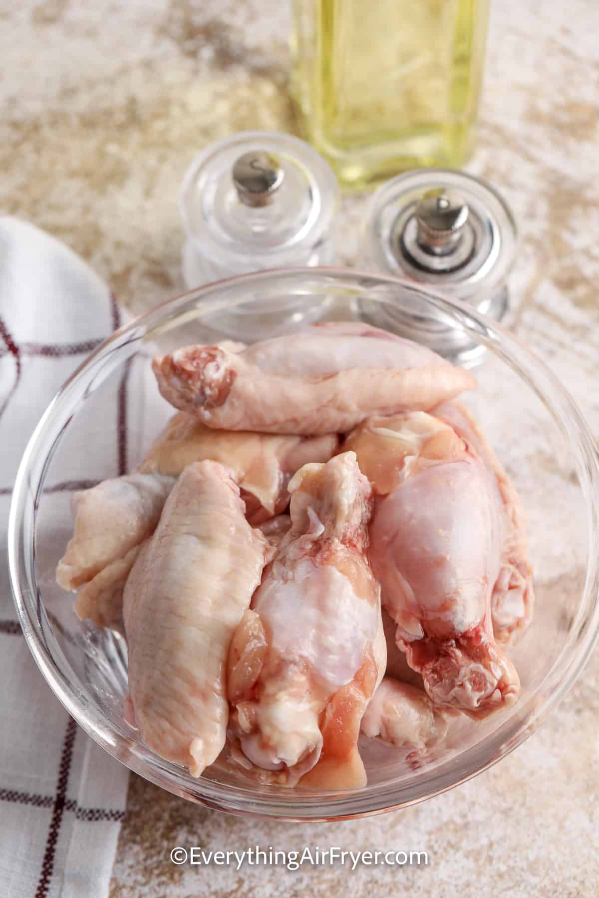 uncooked chicken wings in a bowl