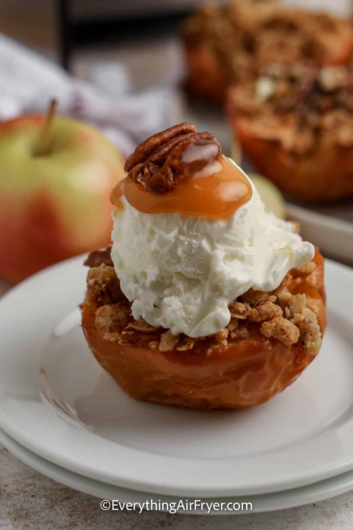 baked apple topped with ice cream and caramel