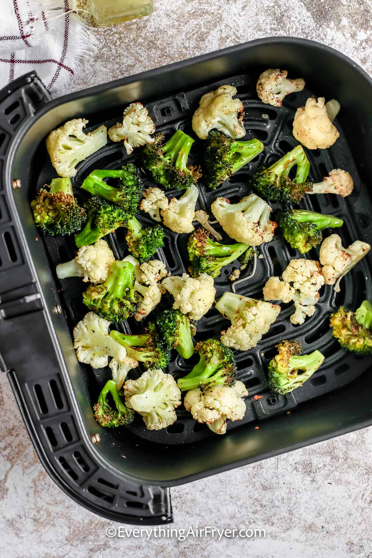 Broccoli and Cauliflower cooked in an air fryer basket