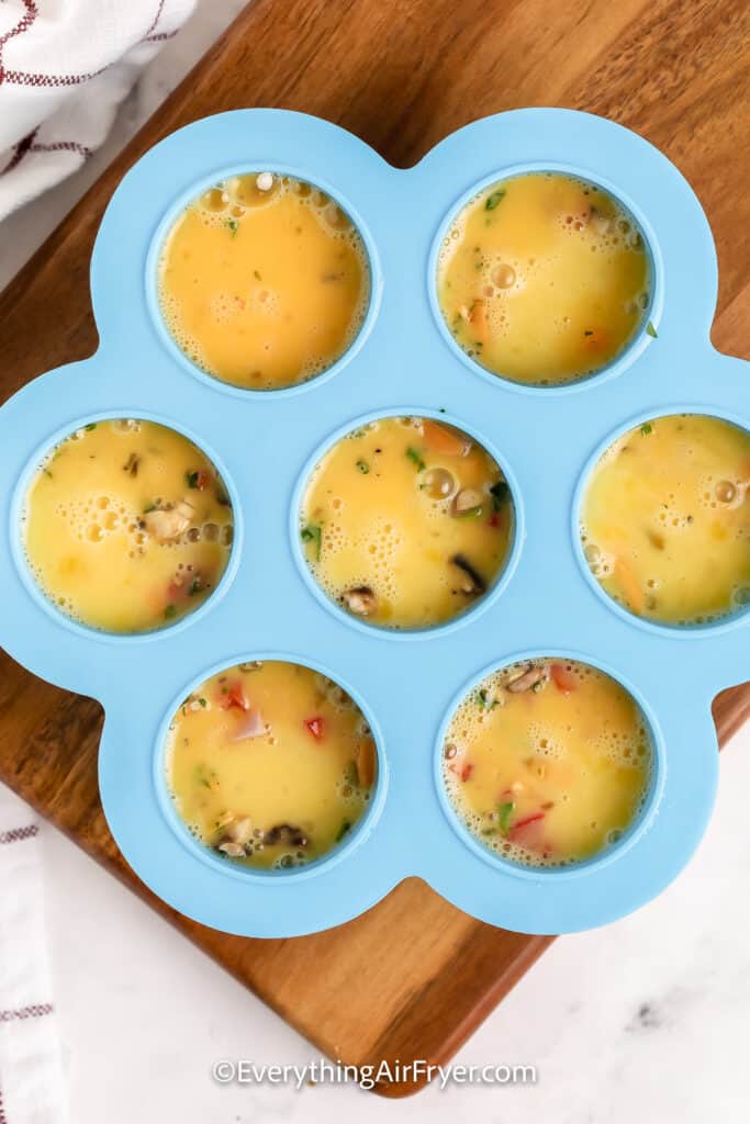 Air Fryer Egg Bites prepped in a silicone baking tray