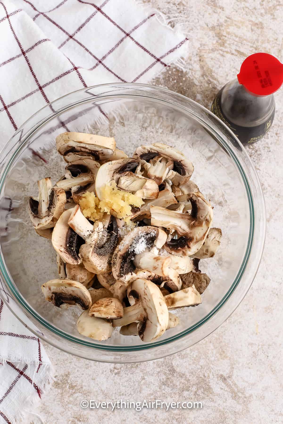 sliced mushrooms in a bowl with garlic