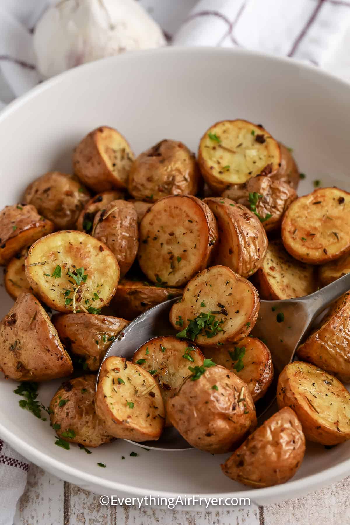 a bowl of Air Fryer Roasted Garlic & Rosemary Potatoes
