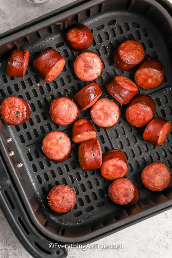 Smoked Sausage cooked in an air fryer basket