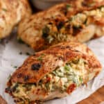 Air Fryer Stuffed Chicken Breasts on a cutting board garnished with parsley