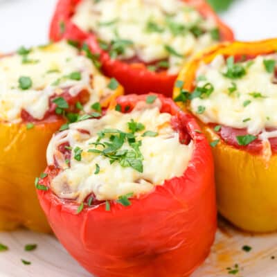 stuffed peppers on a plate topped with parsley