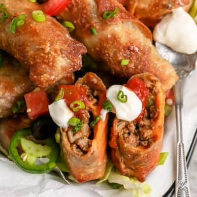 Tex Mex Egg Rolls topped with sour cream