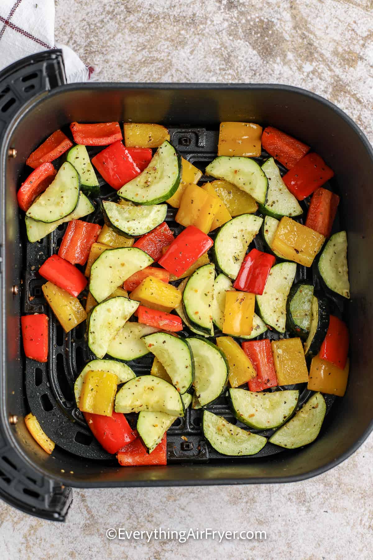 cooked vegetables in an air fryer tray
