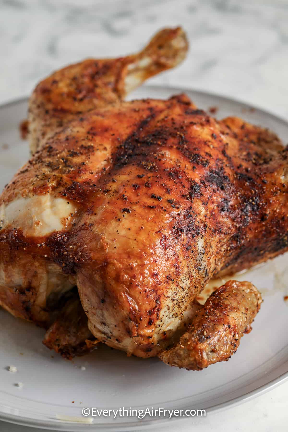 Air Fryer whole chicken on a plate