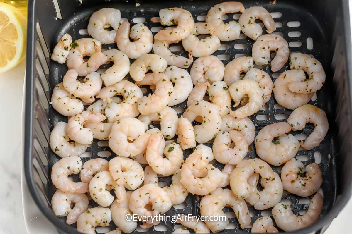 cooked shrimp in an air fryer tray
