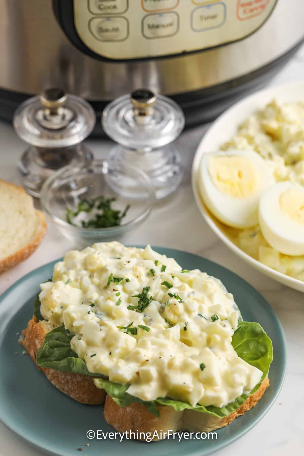 egg salad on a piece of bread with lettuce