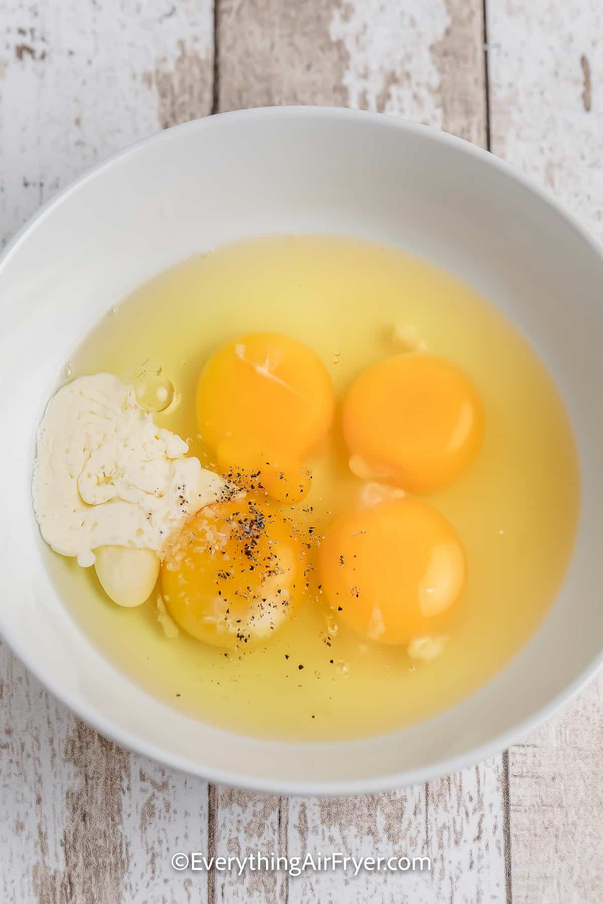 Ingredients to make Microwave Eggs in a bowl