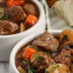 instant pot vegetable beef soup in bowls with text