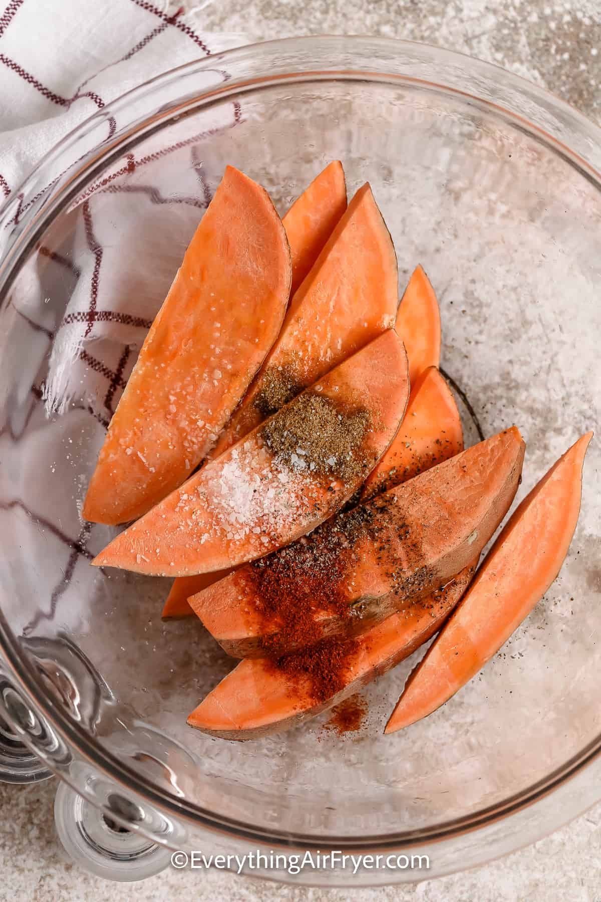 uncooked sweet potato wedges in a bowl
