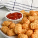 Air Fryer Tater Tots on a plate with ketchup