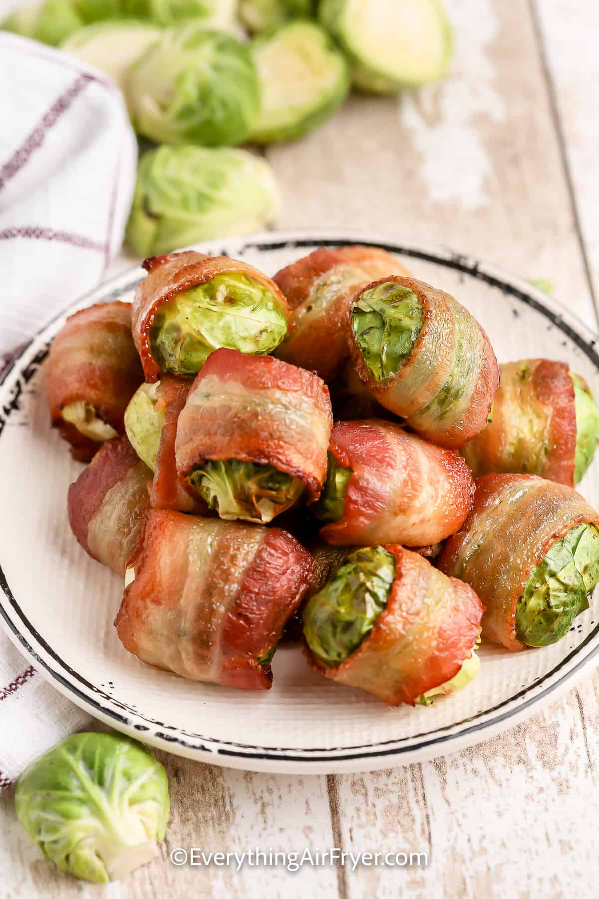 A plate of Air Fryer Bacon Wrapped Brussels Sprouts
