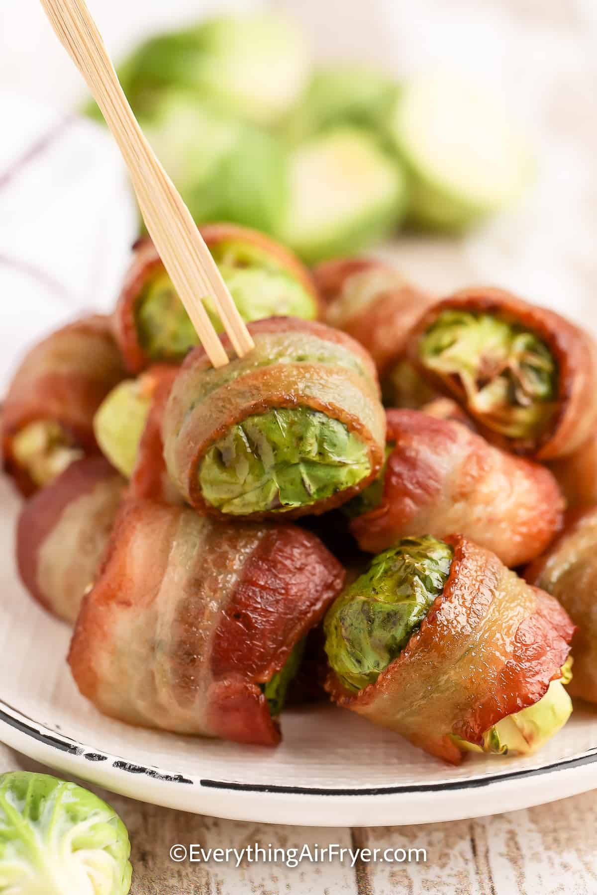 Air Fryer Bacon Wrapped Brussels Sprouts being served