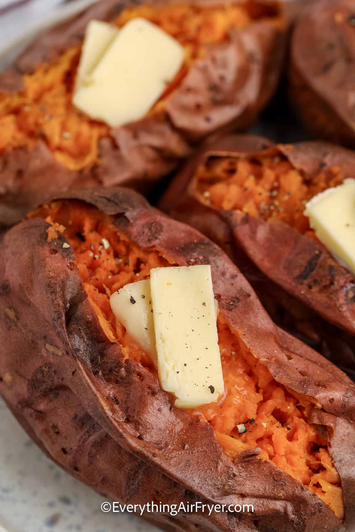 baked sweet potatoes with butter