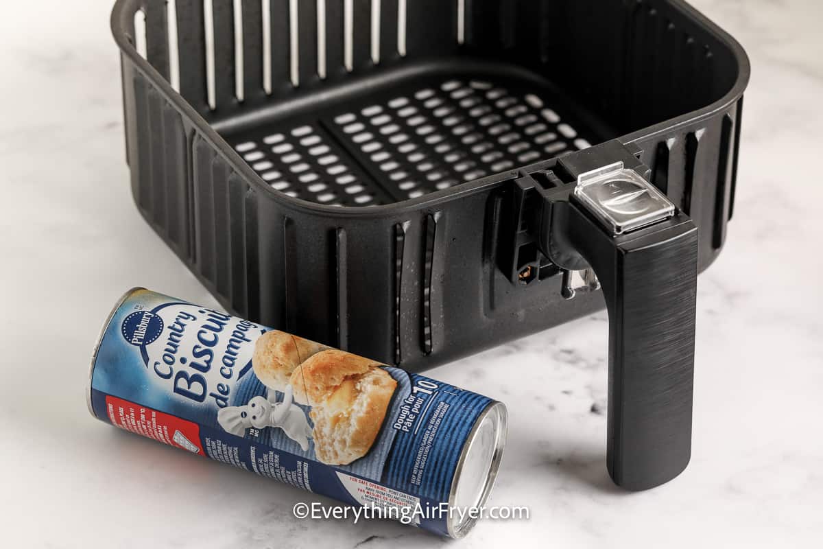 Pilsbury biscuit can next to an air fryer tray
