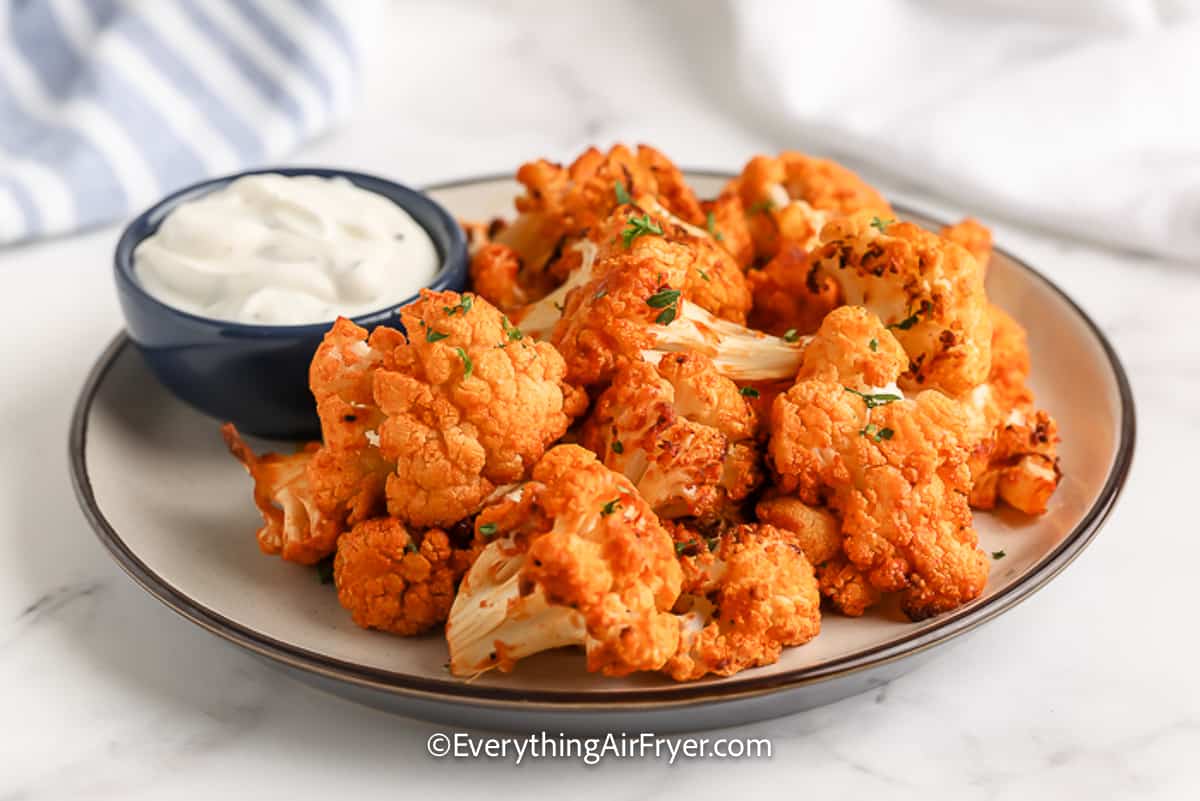 A plate of Air Fryer Buffalo Cauliflower with dipping sauce