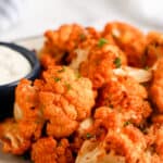 A plate of Air Fryer Buffalo Cauliflower with dipping sauce on the side