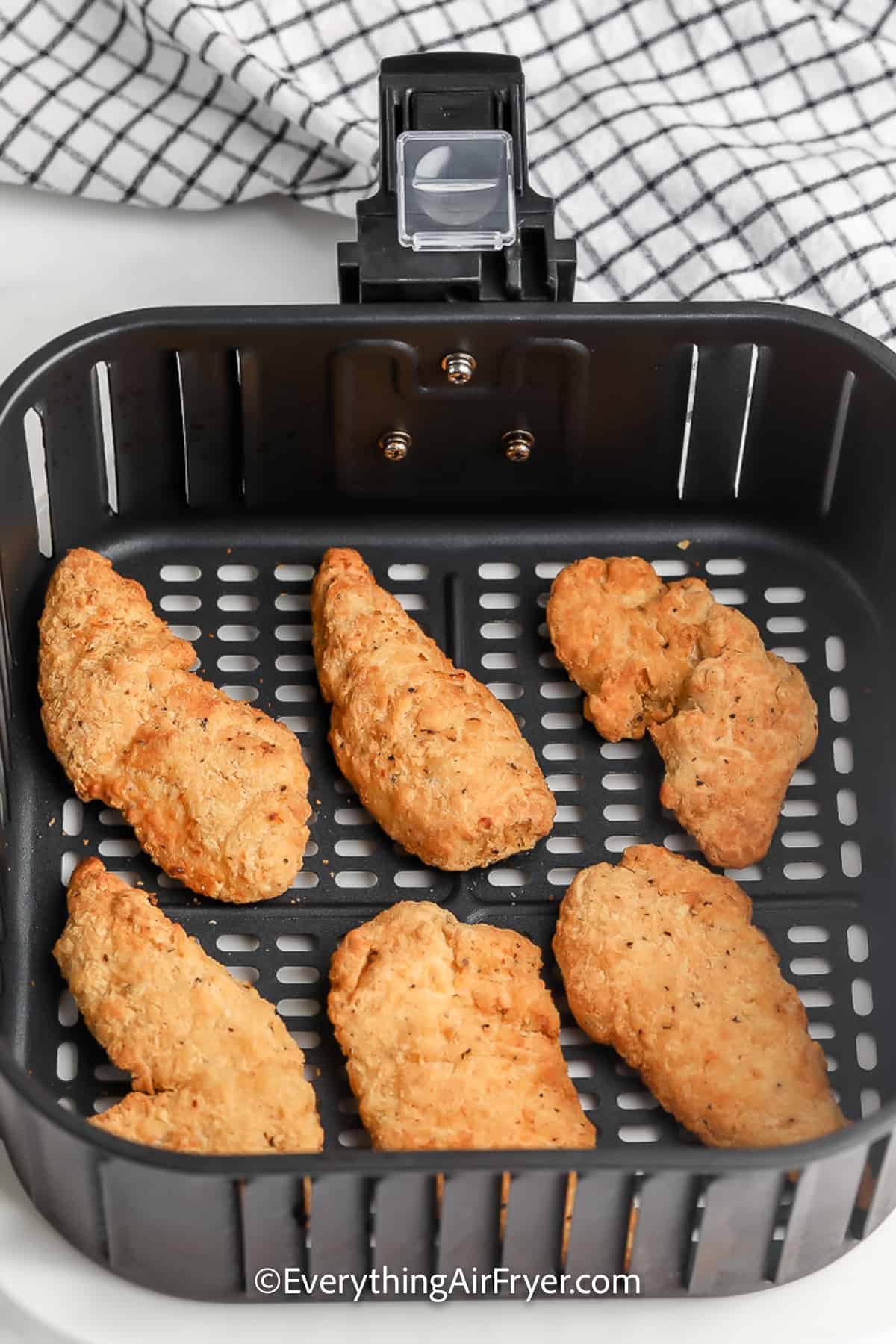 Air Fryer Frozen Chicken Tenders cooked in an Air Fryer Basket