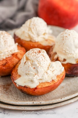 air fryer peaches topped with ice cream
