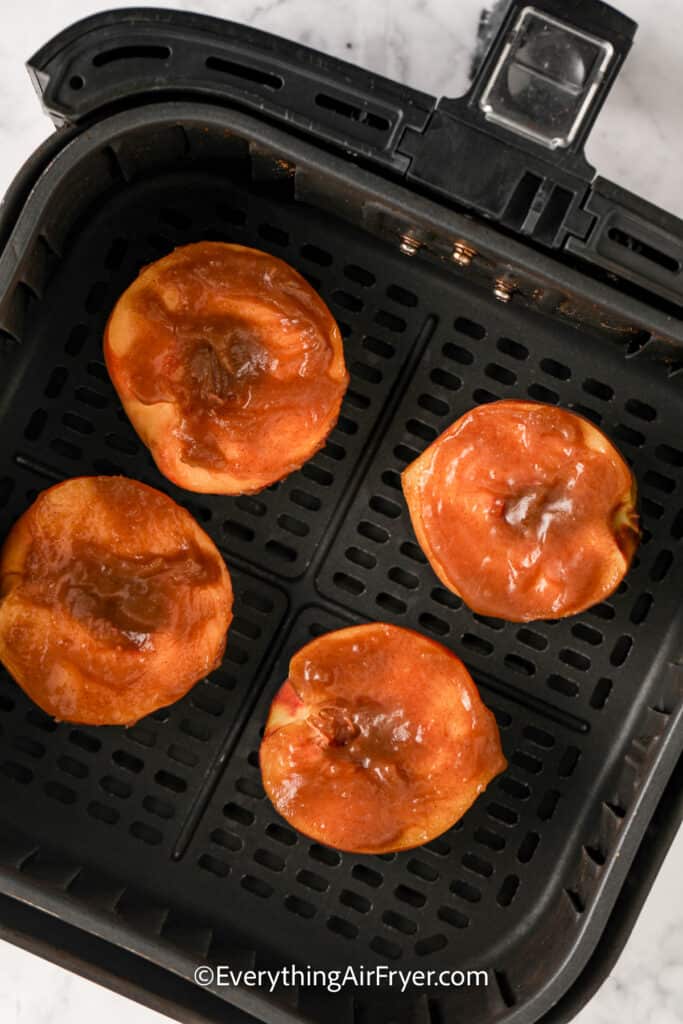 glazed peaches in an air fryer tray