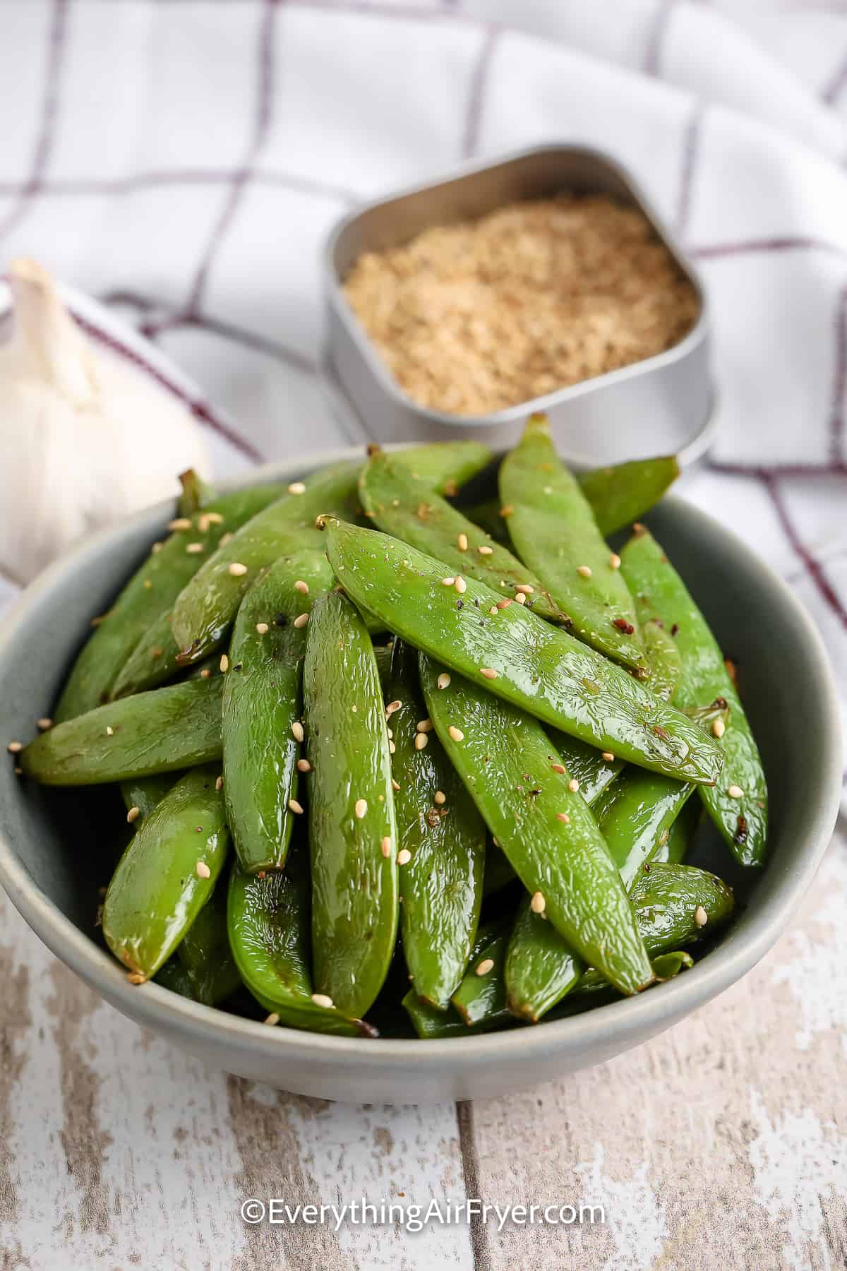 a bowl of air fryer roasted snap peas