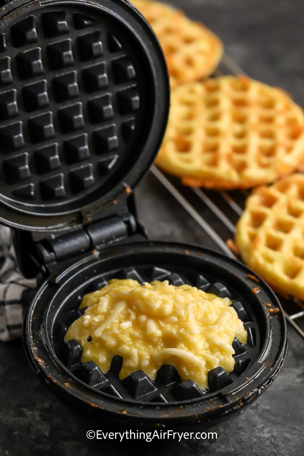 Chaffles mixture poured into a waffle iron