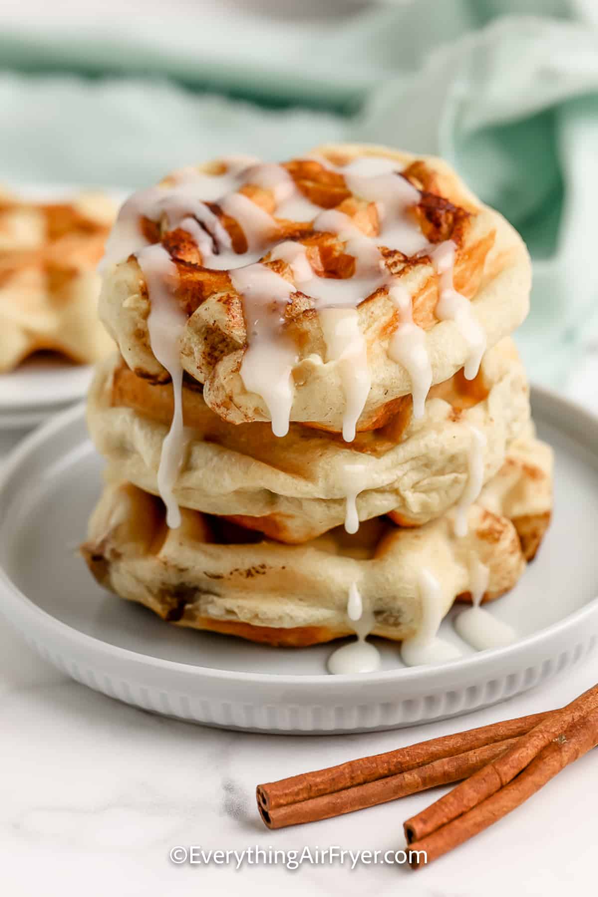 Cinnamon Roll Waffles topped with icing