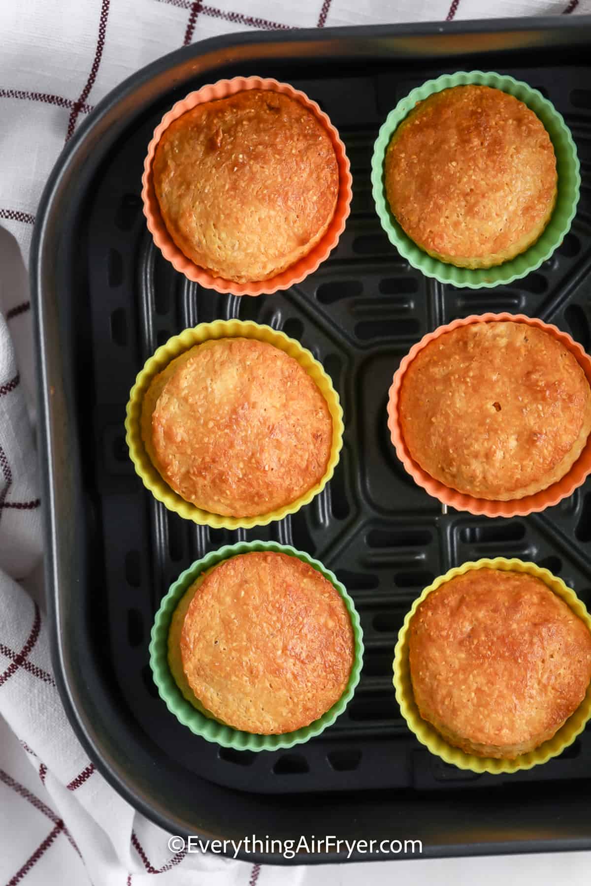Baked Air Fryer Cornbread Muffin Recipe in an air fryer basket