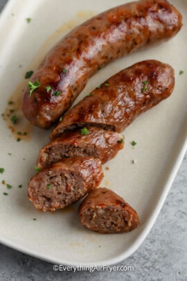 Air Fryer Italian Sausage sliced on a plate