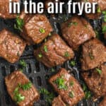 cooked Air Fryer Steak Bites in the air fryer with writing