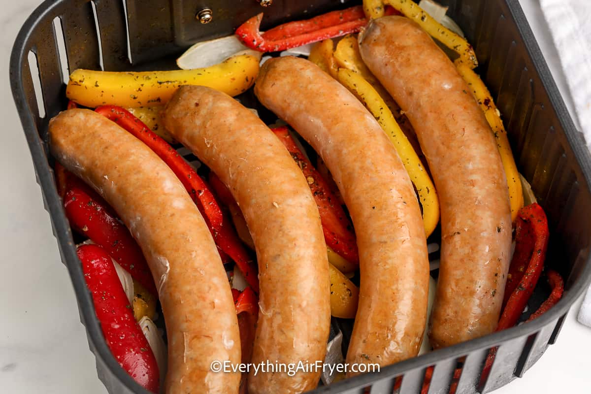 sausage and peppers in an air fryer tray