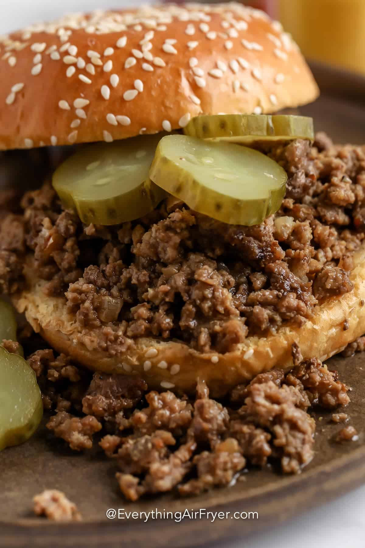 a loose meat sandwich with pickles