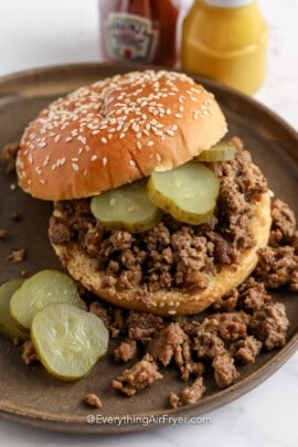 a loose meat sandwich on a plate