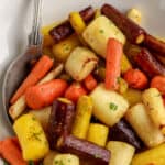 air fryer roasted rainbow carrots in a bowl with text