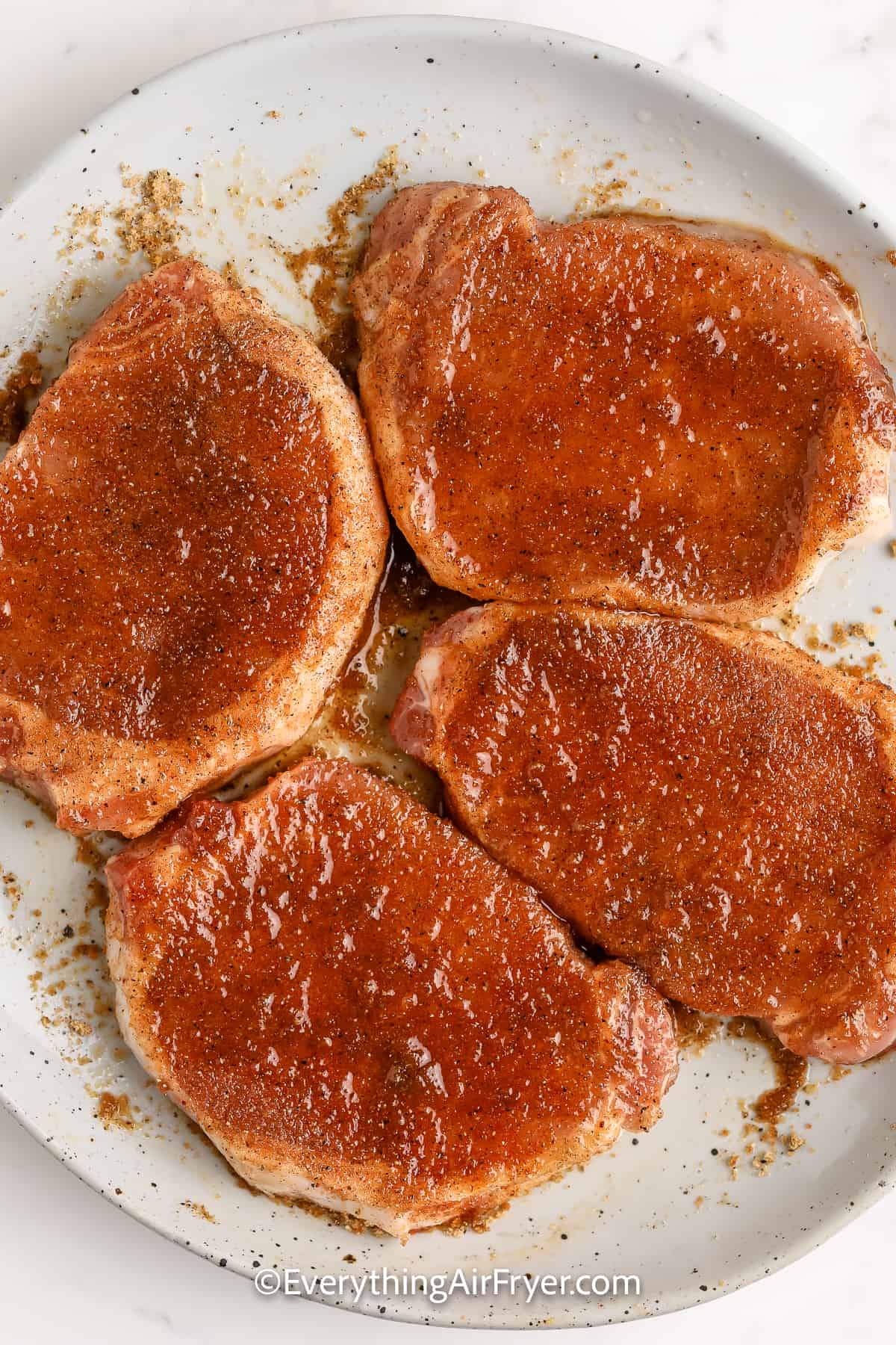 air fryer brown sugar pork chops on a plate