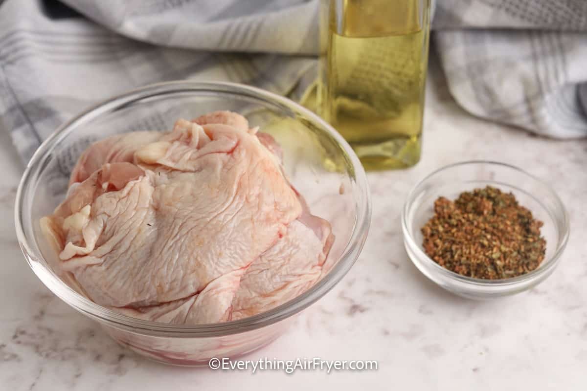 ingredients assembled to make air fryer cajun chicken thighs
