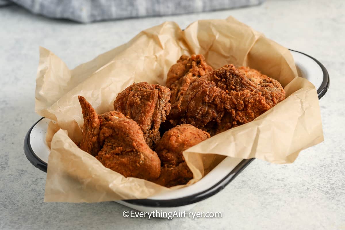 fried chicken in a dish with parchment paper