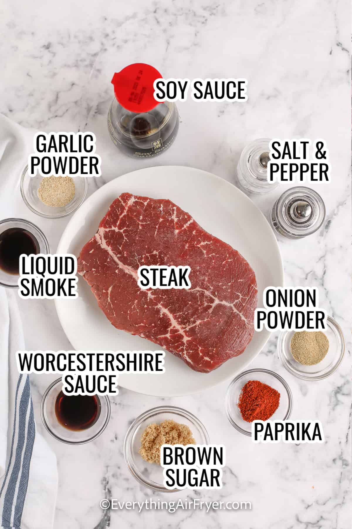 ingredients assembled to make instant vortex air fryer jerky, including steak, soy sauce, garlic powder, worscestershire sauce, onion powder, and paprika