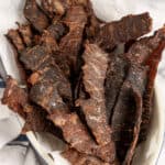 instant vortex air fryer jerky in a dish with parchment paper