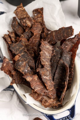 instant vortex air fryer jerky in a dish with parchment paper