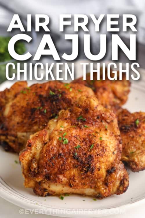 air fryer cajun chicken thighs on a plate with text