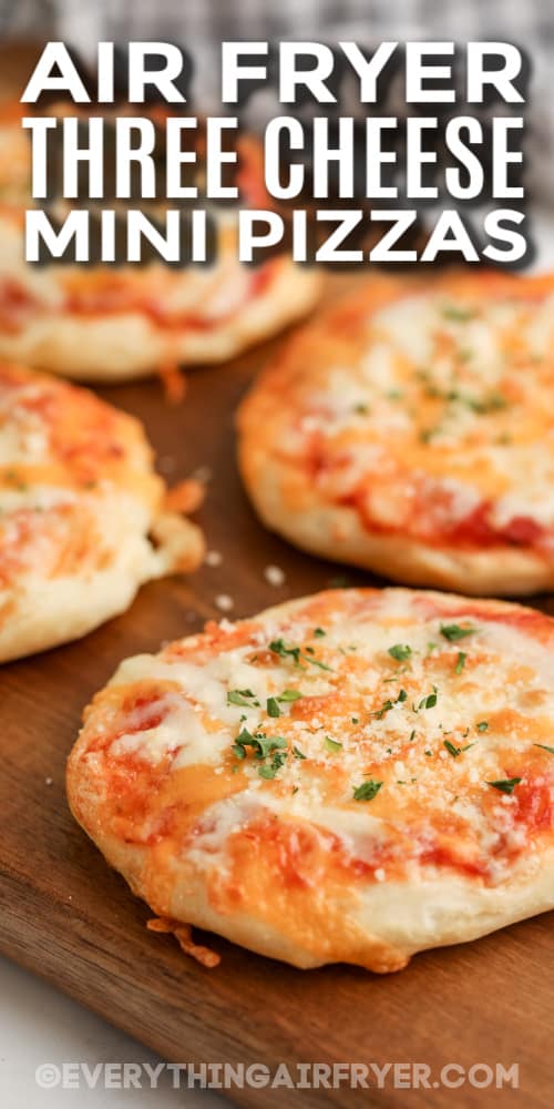 air fryer three cheese mini pizzas on a cutting board with text