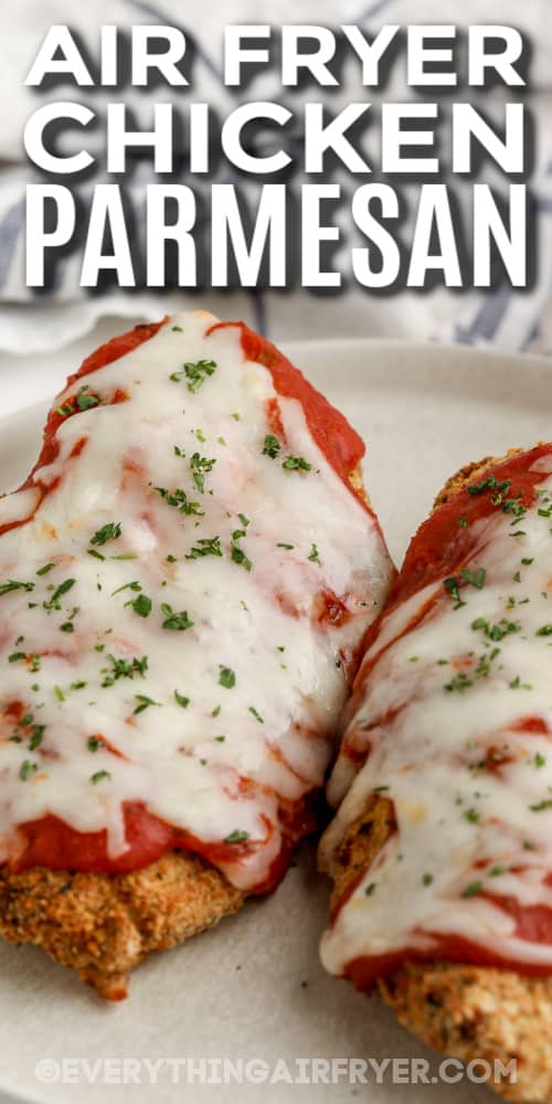 chicken parmesan topped with parsley with text