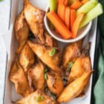 plated Air Fryer Buffalo Chicken Wontons with carrots and celery