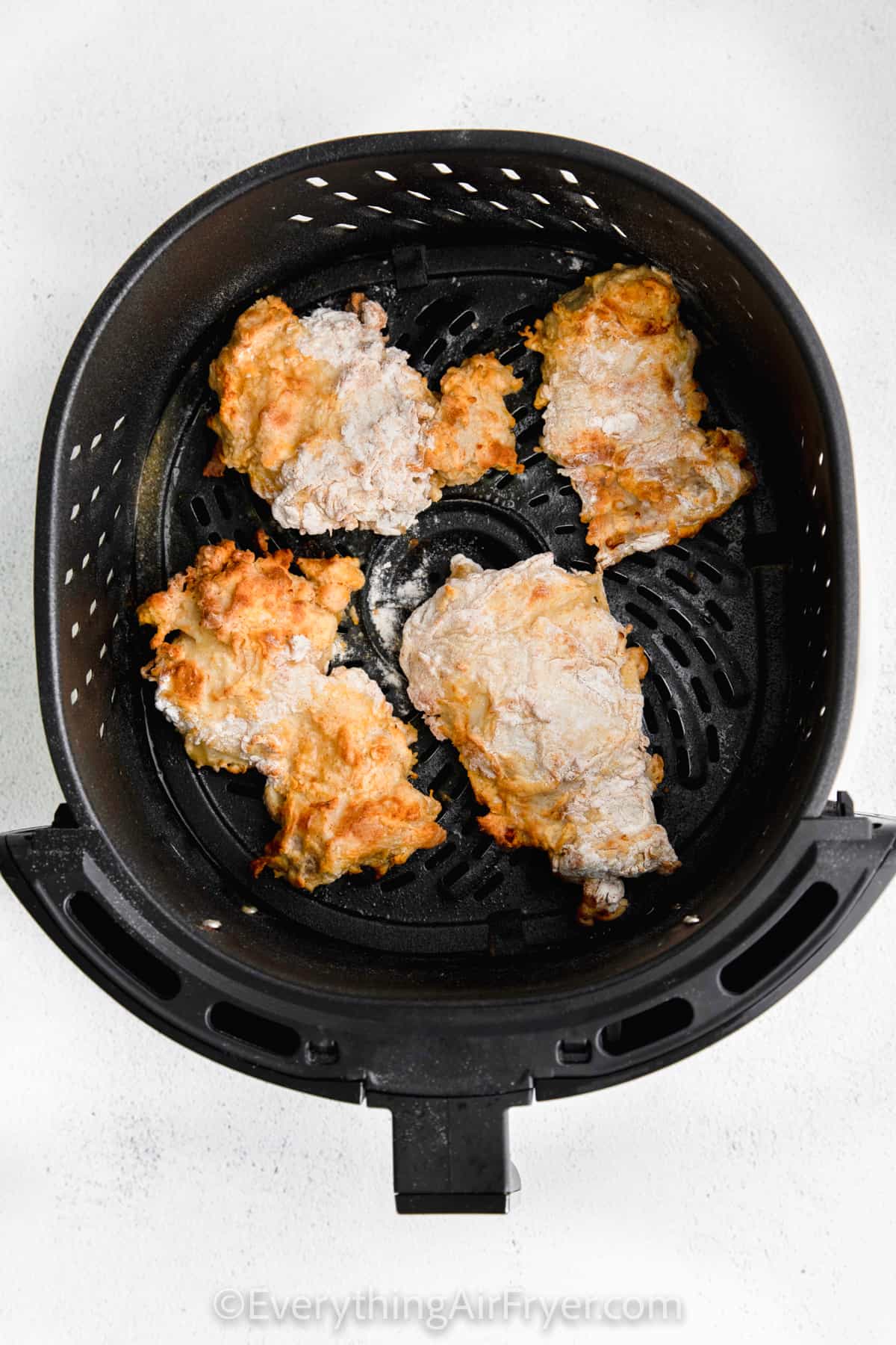 cooked chicken in the fryer to make Air Fryer Chicken and Waffles