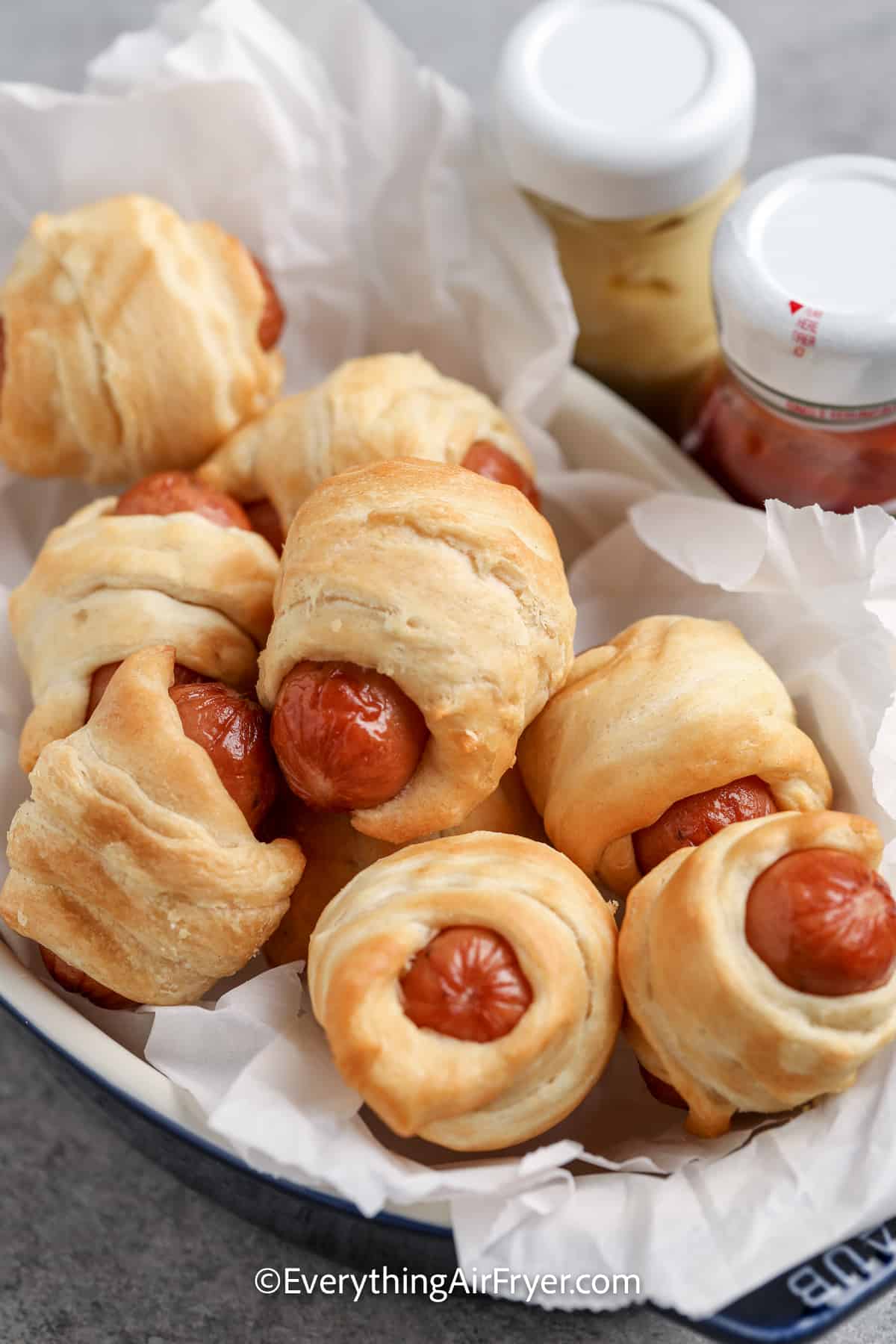 air fryer pigs in a blanket with ketchup and mustard
