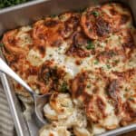 spoon scooping air fryer scalloped potatoes
